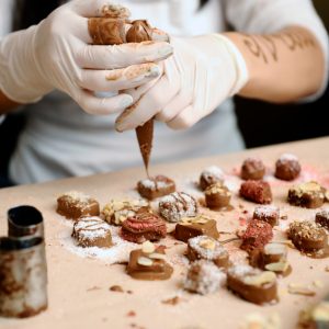 Confectioner decorated chocolates.